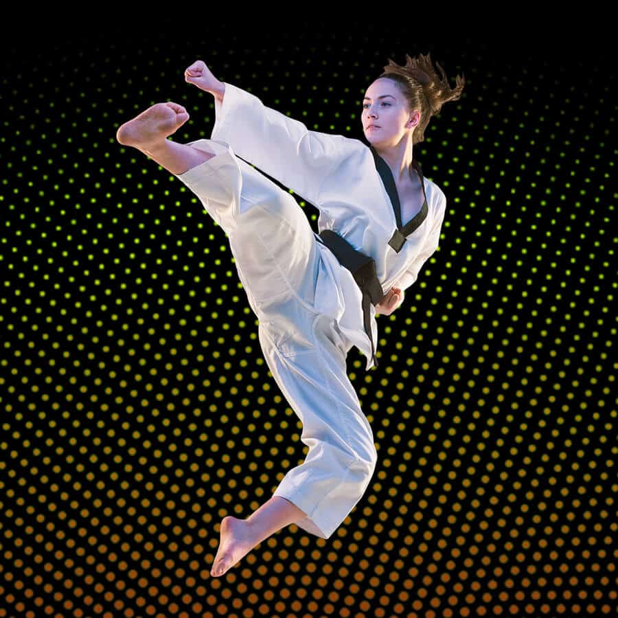 Martial Arts Lessons for Adults in Woodbridge VA - Girl Black Belt Jumping High Kick